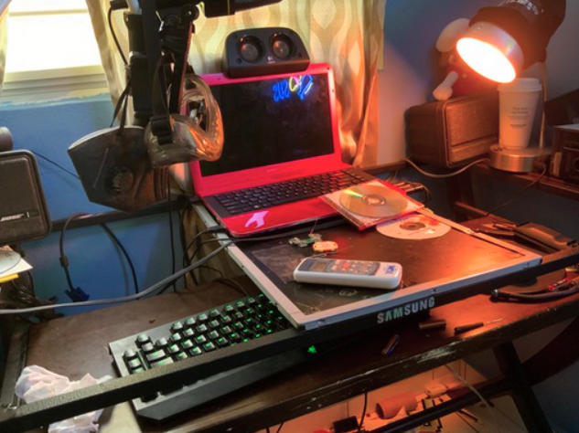 A broken table using a broken tv led panel as a temporary stand in.